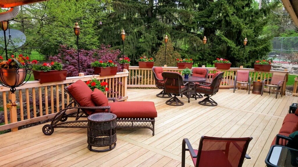 wooden deck with red chairs